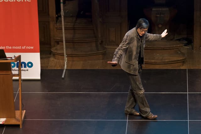 A man, Teemu Arina, apreas to be dancing on stage