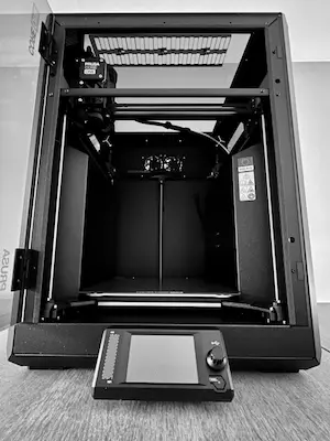 Our fully assembled Prusa CORE One printer with the door open